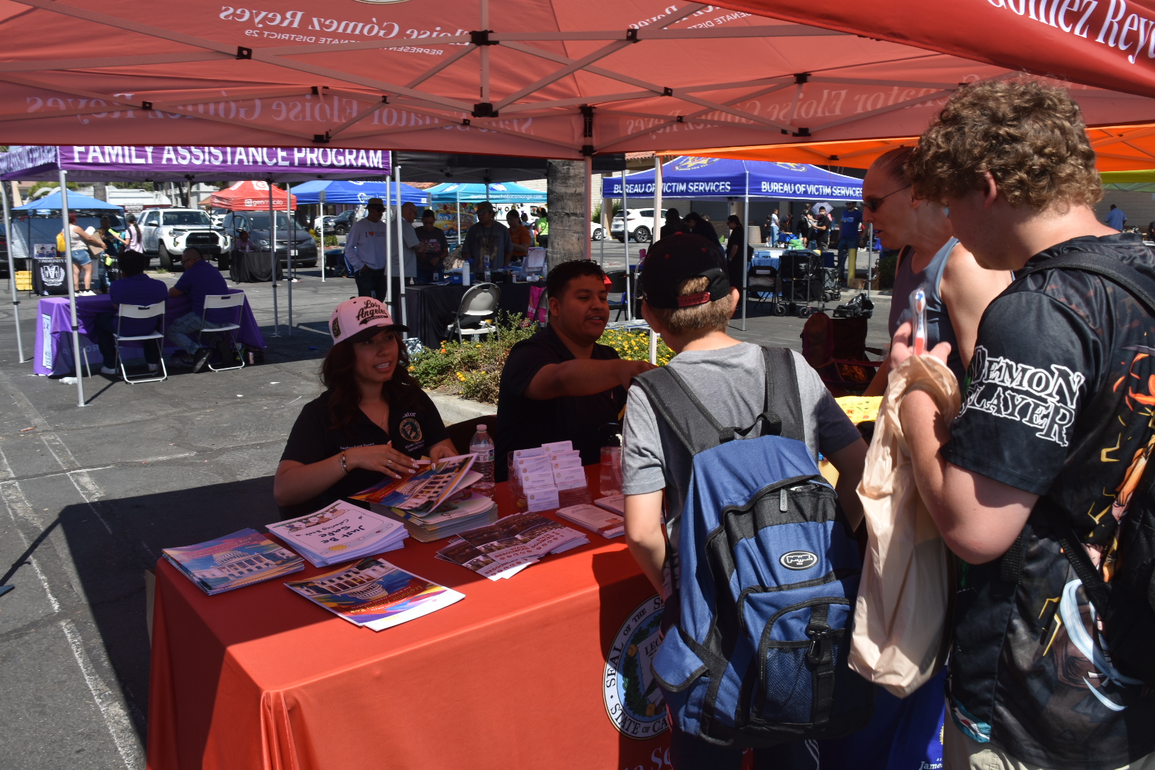 Kids visit Senator Reyes' booth to collect resources for Back to School