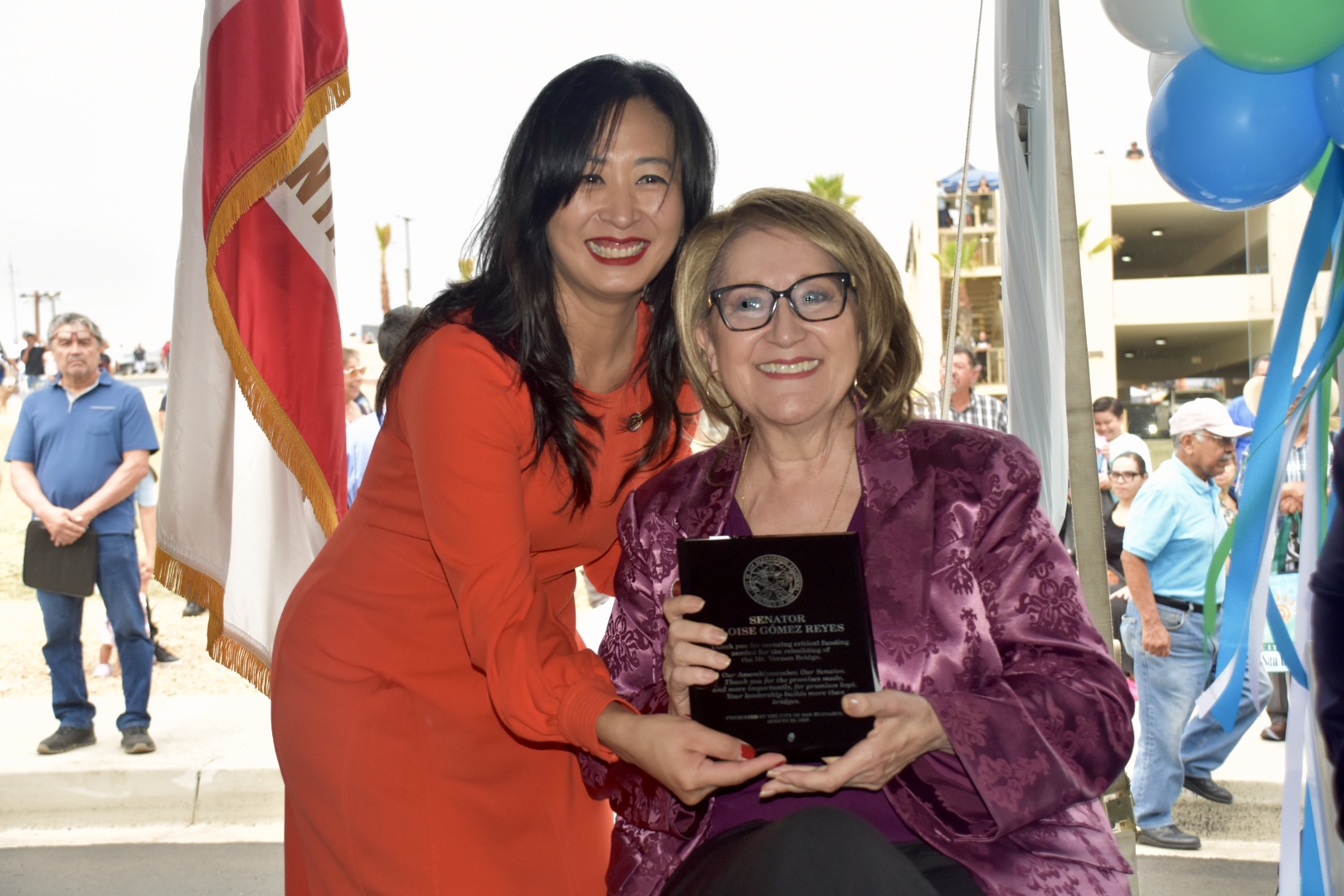 Senator Reyes accepts a plaque from San Bernardino Mayor for her contribution to the new bridge. 