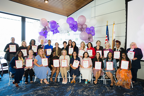 2026 Women of Distinction pose with their certificates
