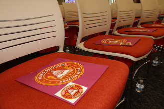 A program for the 2026 Young Senators program is pictured on a chair at the orientation