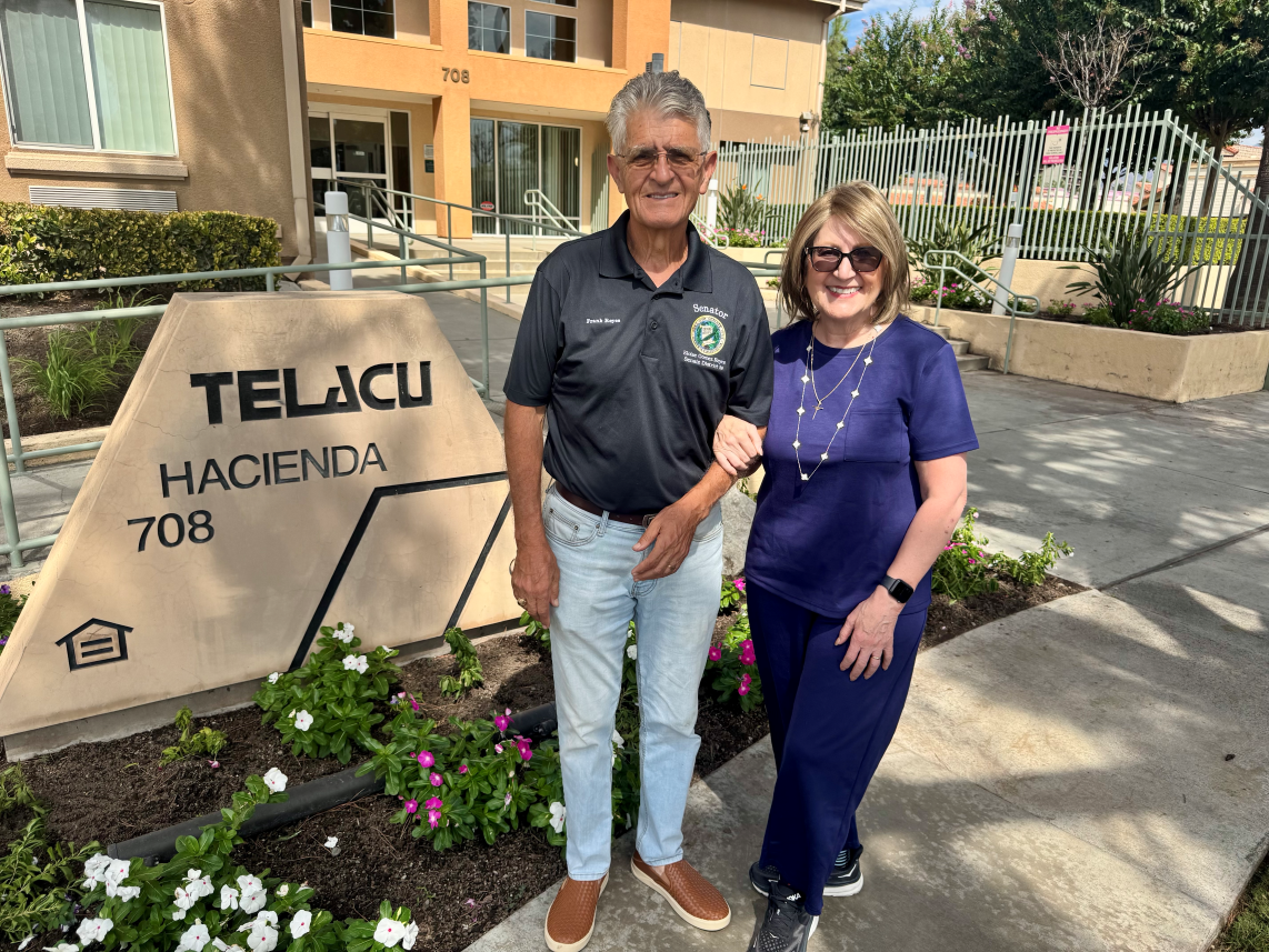 Senator Reyes and husband Frank stand in front of TELACU San Bernardino